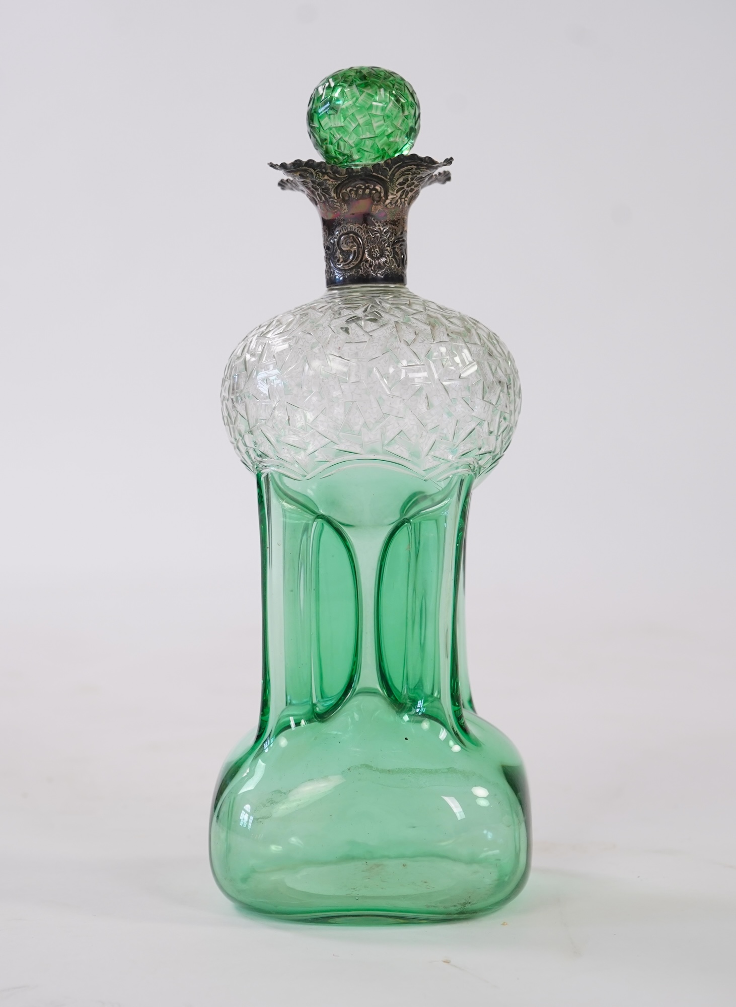 Attributed to Stevens and Williams of Stourbridge, a green flashed and cut pinched glass decanter